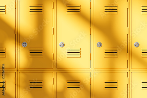 Obraz na płótnie Bright yellow school lockers in sunlight forming an education concept and clean study atmosphere in modern hallway background