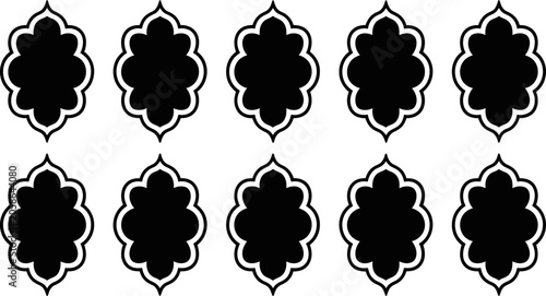 Ten identical black and white ornamental quatrefoil shapes in a grid pattern