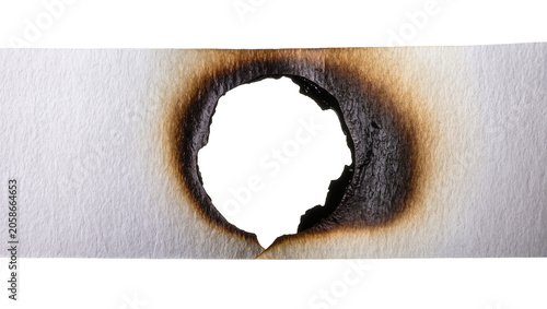Burnt hole in textured paper, isolated on transparent background