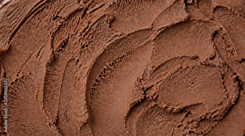 Texture of chocolate ice cream background, close up. chocolate gelato top view. Overhead view of chocolate ice cream surface.