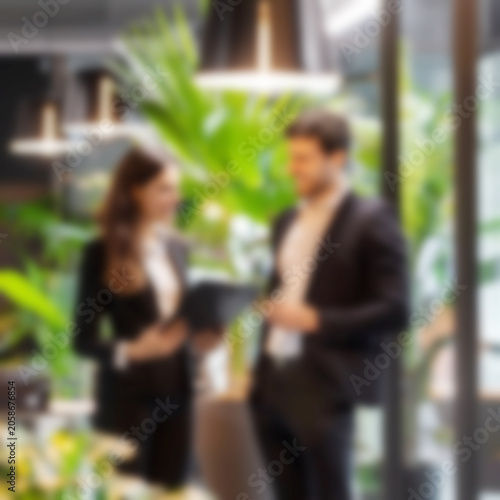 Abstract blurred interior modern office space with business people working banner background with copy space.