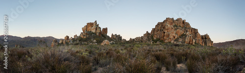 Photography Rocky granite peaks in arid scrubland landscape