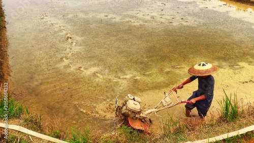 Farmers use tillers to plow, transplant rice seedlings, and fertilize in the fields.