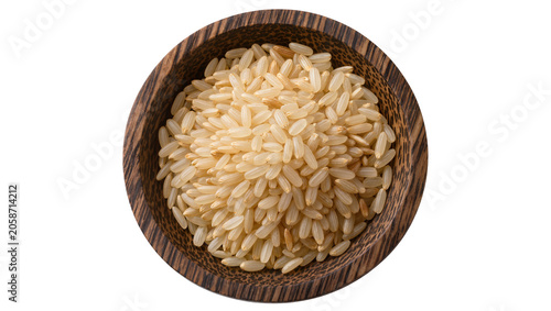 Fotografie Brown rice grains in wooden bowl