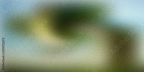 Blurred abstract nature scene with swirling greens, yellows, and blues, soft focus