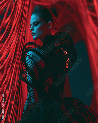 Woman portrait in red draped fabric