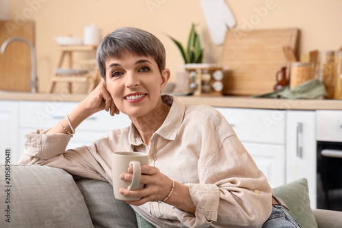 Relaxed mature woman enjoyi...
