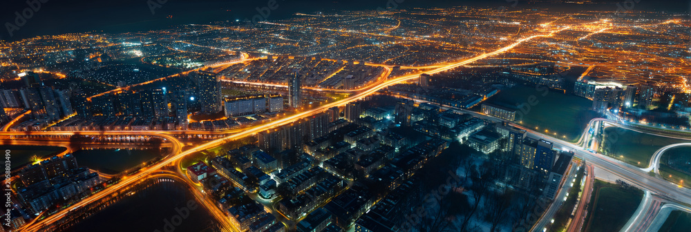 Fototapeta premium Pulsing orange light trails map a vast urban network from above, evoking data flow, smart city infrastructure, and global connectivity. Perfect for tech, AI, and innovation campaigns.
