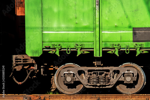 Close-up of a freight train wheel mechanism on a railway track