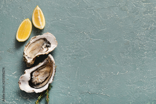 Fresh raw oysters with lemo...