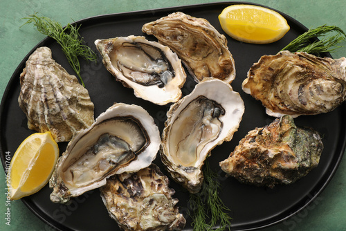 Fresh raw oysters with lemo...