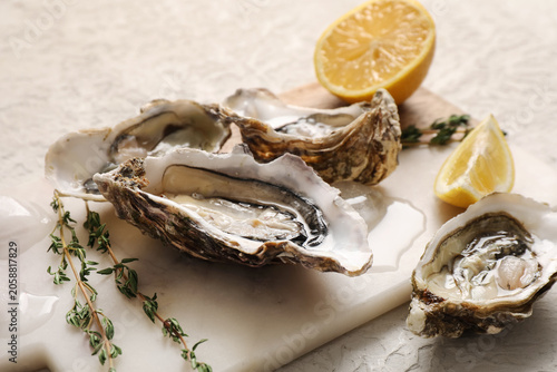 Fresh raw oysters on ice wi...