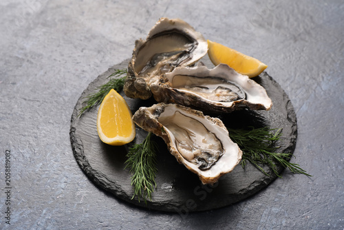 Fresh raw oysters with lemo...