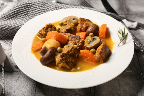 Hearty beef stew with carro...