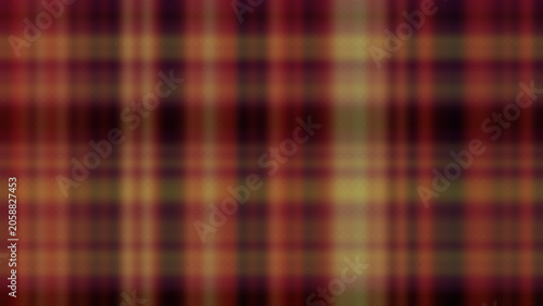 Blurred plaid fabric pattern in deep red, brown, and mustard yellow
