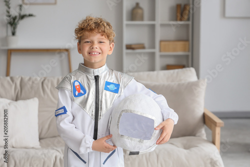 Smiling young boy in astron...