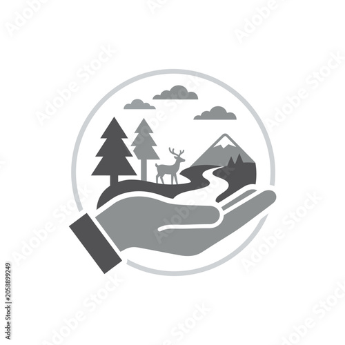 Hand holding circular nature landscape with deer
