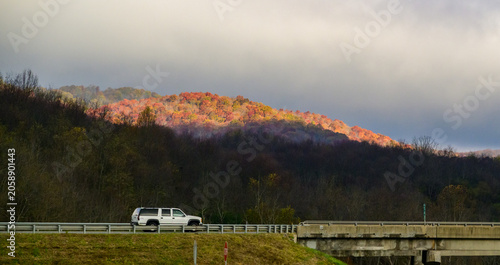 This image depicts a scenic drive through the Appalachian Mountains during the autumn season.