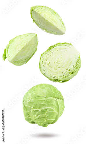 green cabbage with pieces isolated on white background. clipping path