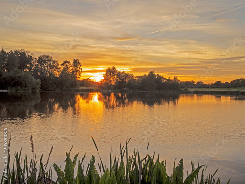 Beautiful late springtime sunset over water at Marston, Northwich, Cheshire, UK