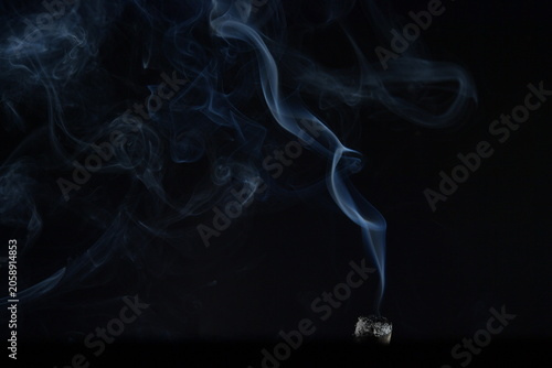 Quadro su tela Ethereal Smoke Swirls Against a Dark Background Creating a Mysterious and Atmosp