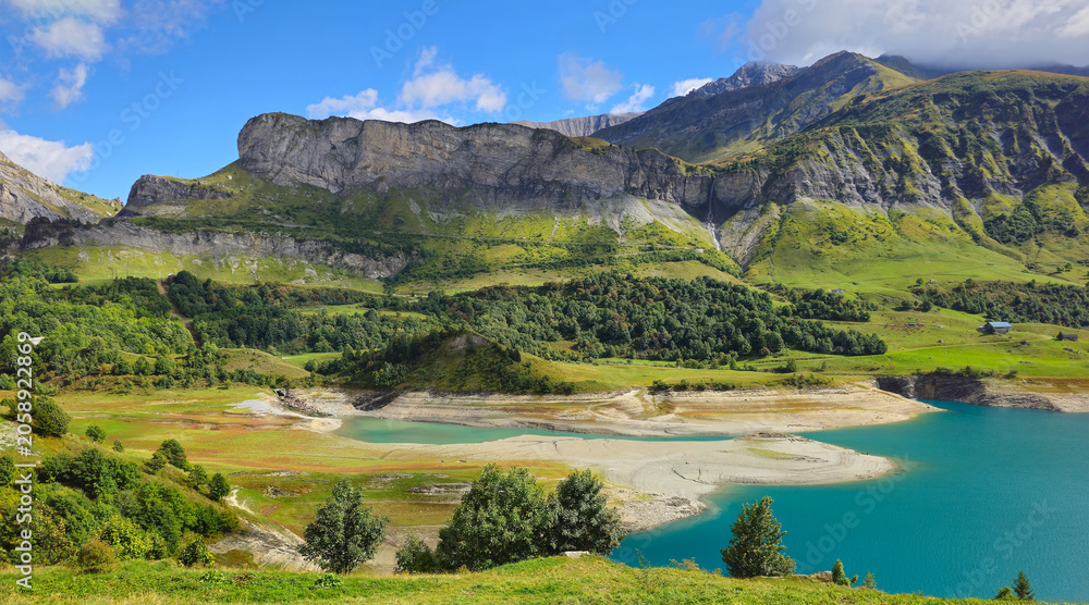 Fototapeta premium Lake Lac de Roselend in the mountains landscape, French Alps, Beaufort, Savoie, France, Europe.