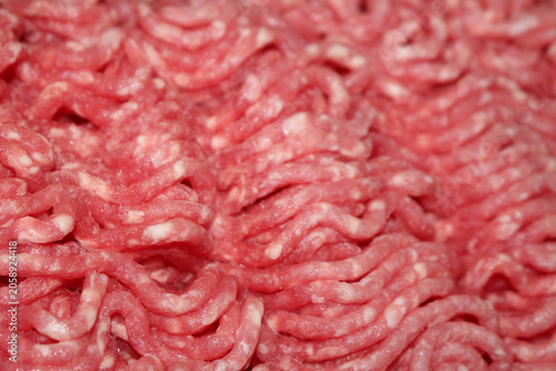 raw minced beef. Close up of ground meat. Raw minced meat with selective focus. Close up of raw minced meat with blurred background.