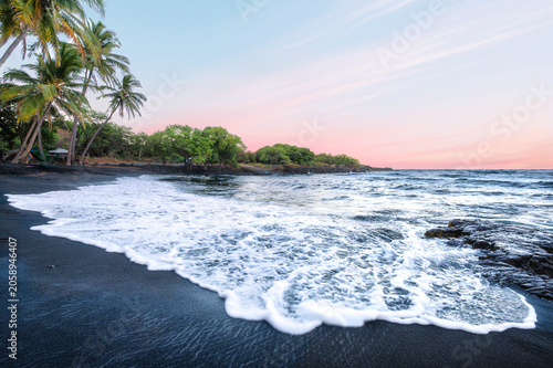 Konstfotografi Peaceful Sunset on a Black Sand Volcanic Beach with Palm Trees and Pink Sky, Pun