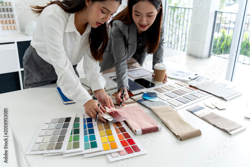 Interior Design Team Presenting Color Samples Material Swatches Professional Studio Consultation