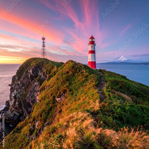 Coastal cliff, lighthouse, sunset