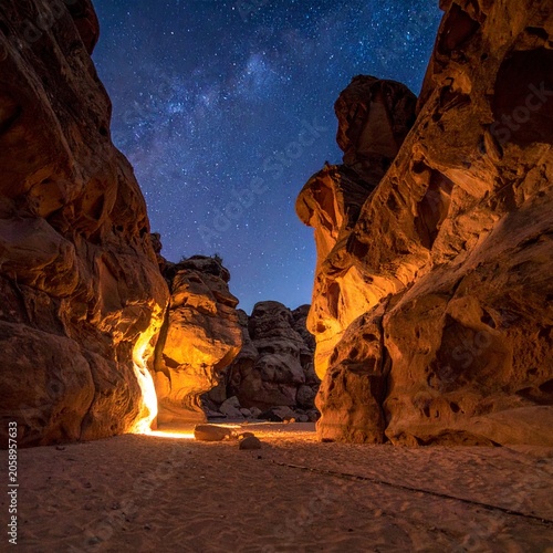 Desert canyon under starry sky