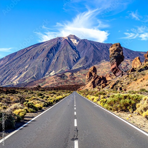 Empty desert highway to volcano