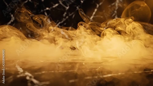 Golden smoke rolling and spreading across a reflective black marble surface, close-up slow motion