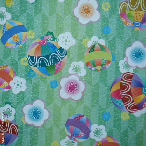 Obraz na plátně Traditional Japanese Temari Balls and Plum Blossoms on Green Background -colorfu