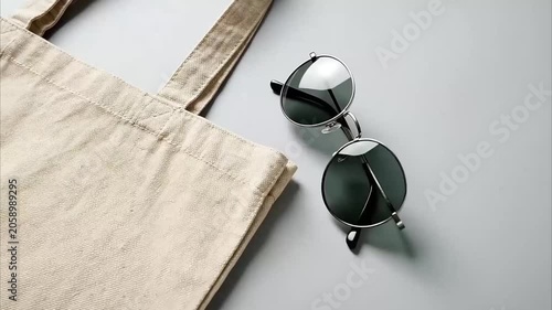 Sunglasses on white background and wooden table showing stylish eyewear accessory for summer sun protection and fashion style Videos