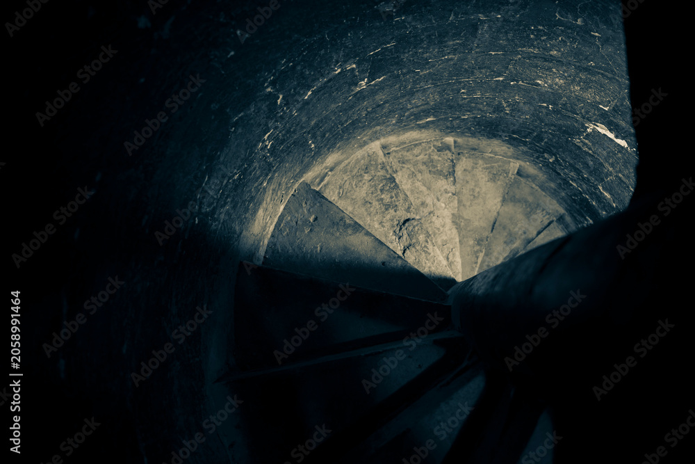 Fototapeta premium Deep Well Shaft with Shadowed Circular Opening and Textured Walls