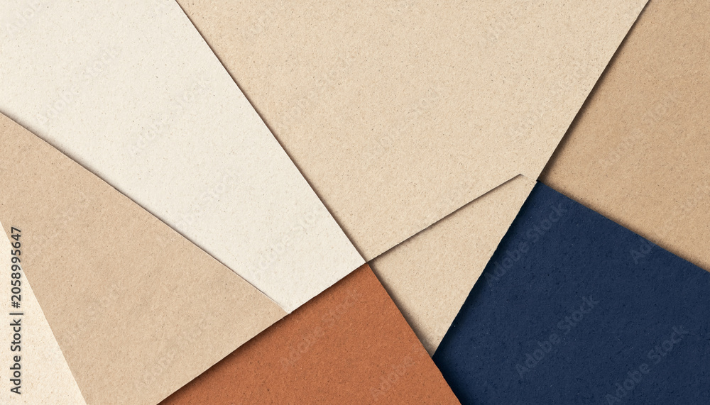Fototapeta premium Abstract geometric pattern with overlapping textured cardboard and paper sheets in blue and warm beige abstract geometric cardboard background minimalist composition artistic structure