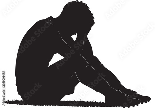Athlete sitting on the ground displays signs of deep sadness, disappointment, or exhaustion after a difficult match.