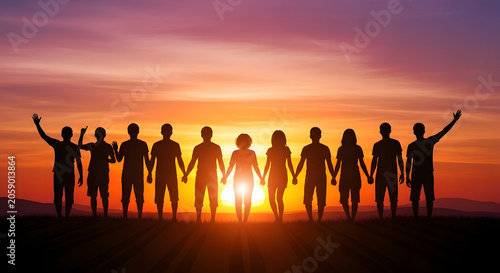 People holding hands at sunset