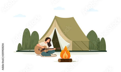   girl with a guitar sits by the fire