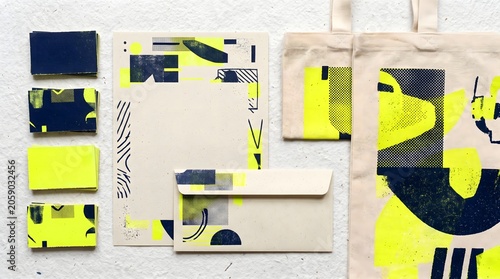 Abstract graphic design stationery set with neon yellow and navy blue shapes stationery branding envelope abstract geometric artistic corporate identity creative