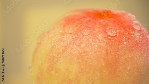 Close-Up Ripe Peach with Water Droplets
