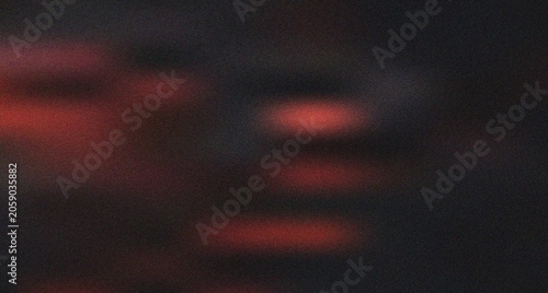 Deep crimson and muted red abstract blur on a dark grainy surface evoking a sense of solemnity and depth