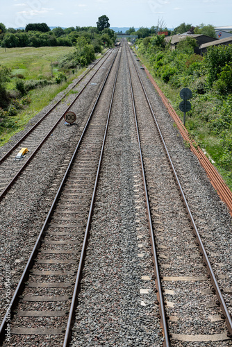 Double-track railway main line curving through green countryside near Ashchurch, Tewkesbury, Gloucestershire