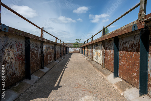 Rusting and Graffiti-covered pedestrian Bridge over the railway near Ashchurch, Tewkesbury, Gloucestershire, Englang