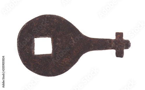Old rusty key isolated on white background.