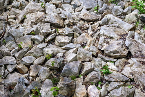 Fotografie A heap of grey stones and boulders.