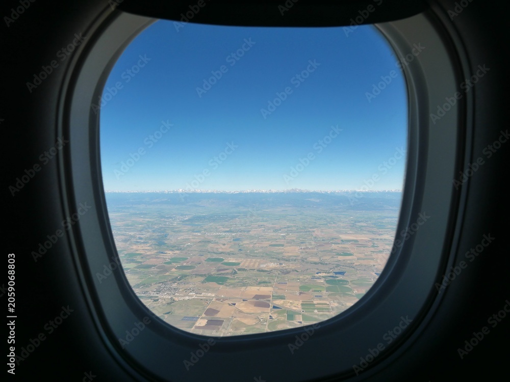 Naklejka premium View of Indian Peaks Wilderness Through an Airplane Window After Departure from Denver Colorado