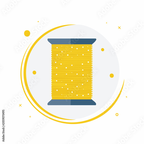 Yellow spool of thread with white dots