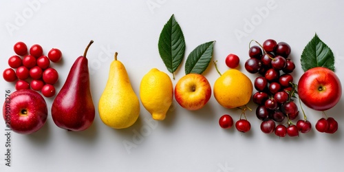 Colorful fresh fruits and berries on white background